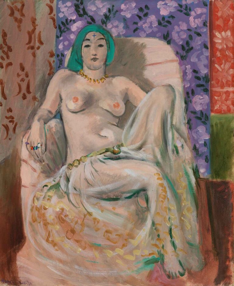 Moorish Woman by Henri Matisse: a seated woman draped in a flowing, patterned robe and turquoise headscarf, posed against a backdrop of purple floral tapestry and geometric panels.