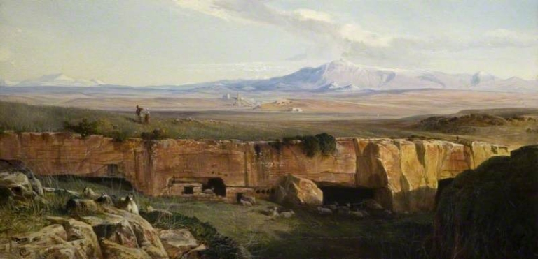 Painting "Rome Campaign" (1878) by Edward Lear. A vast, sunlit landscape of the Roman Campagna with rocky foreground ruins, grassy plains, and two mounted figures riding in the distance. Ancient structures dot the wide open plain beneath distant snow-capped mountains, all under a soft, pale blue sky with scattered clouds, evoking quiet grandeur and timeless stillness.