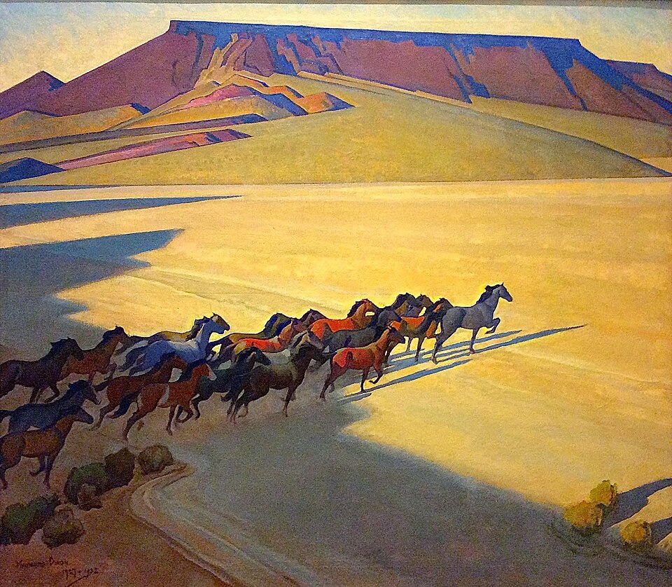 "Wild Horses of Nevada" by Maynard Dixon (1927), depicting a herd of mustangs running diagonally across a sunlit desert plain. The horses cast long shadows across the golden sand, while flat mesas and layered hills in rich purples, blues, and ochres rise in the background under a clear sky. The simplified forms and vibrant colors create a dynamic, modernist portrayal of the Nevada landscape and its wild horses.