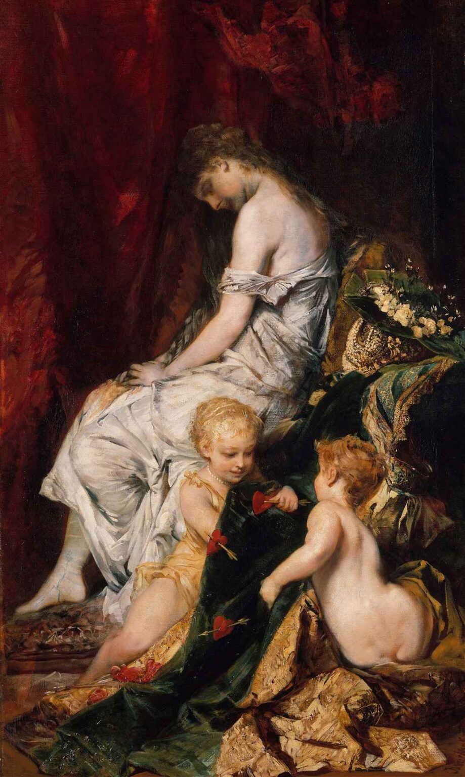 Oil painting of a reclining woman draped in a white gown, her head bowed, with two cherubic children playing with red hearts on gold and green fabrics beneath a deep red curtain.