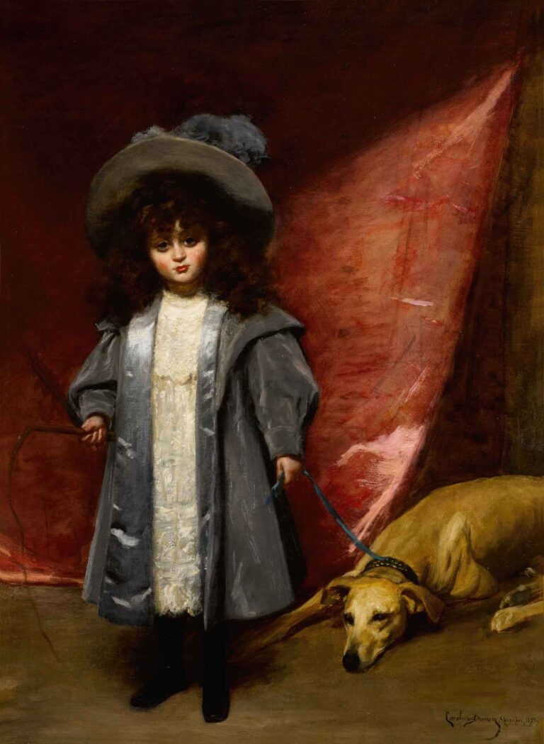 Portrait of a Victorian-dressed girl in a grey coat and lace dress standing before a red curtain, holding a leash attached to a resting greyhound.