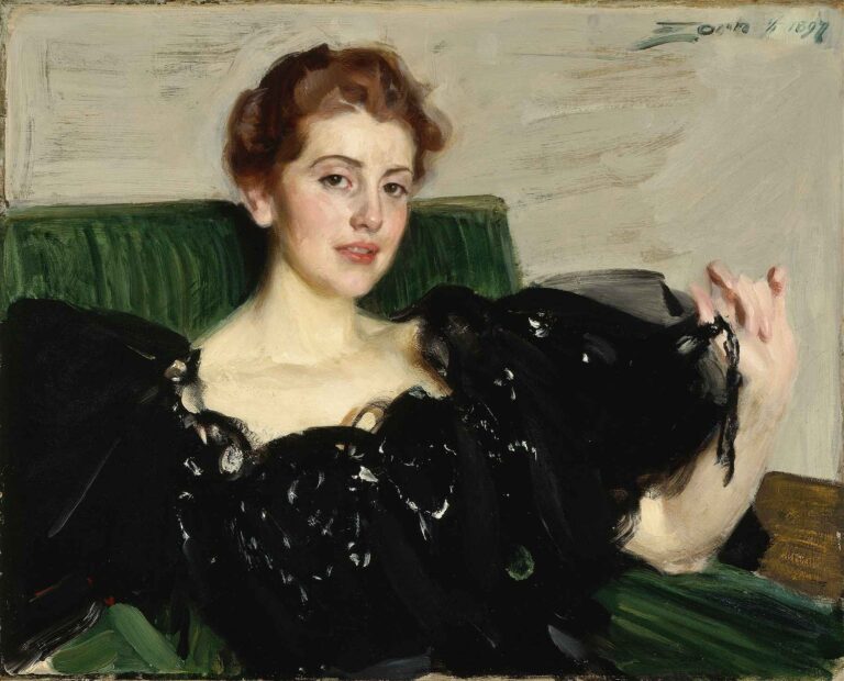 Oil painting by Anders Zorn (1897) depicting Lucy Turner Joy in a black evening dress, seated against a green background with a confident gaze and raised hand, rendered in expressive Impressionist brushwork.