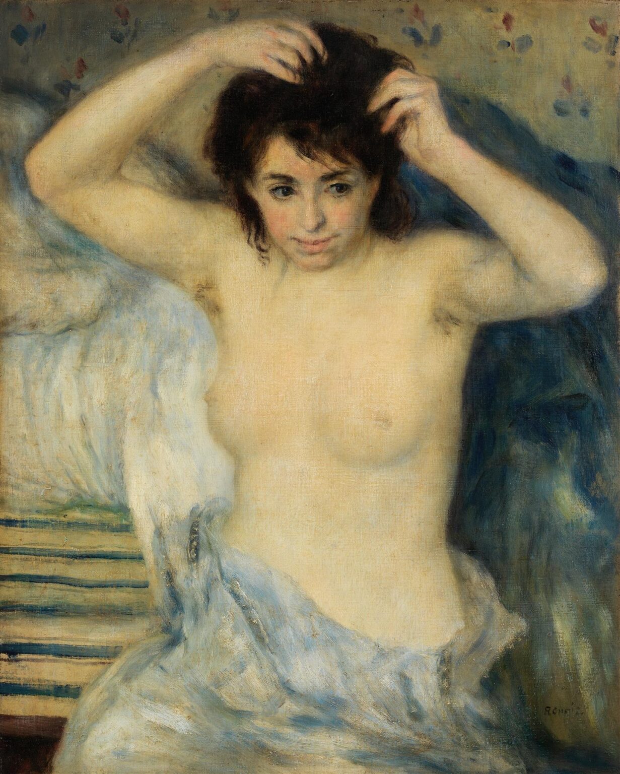 A nude woman standing in shallow river water lifts a cloth above her head as she prepares to bathe, surrounded by leafy banks and shimmering reflections, painted with soft brushstrokes and luminous color by Renoir.
