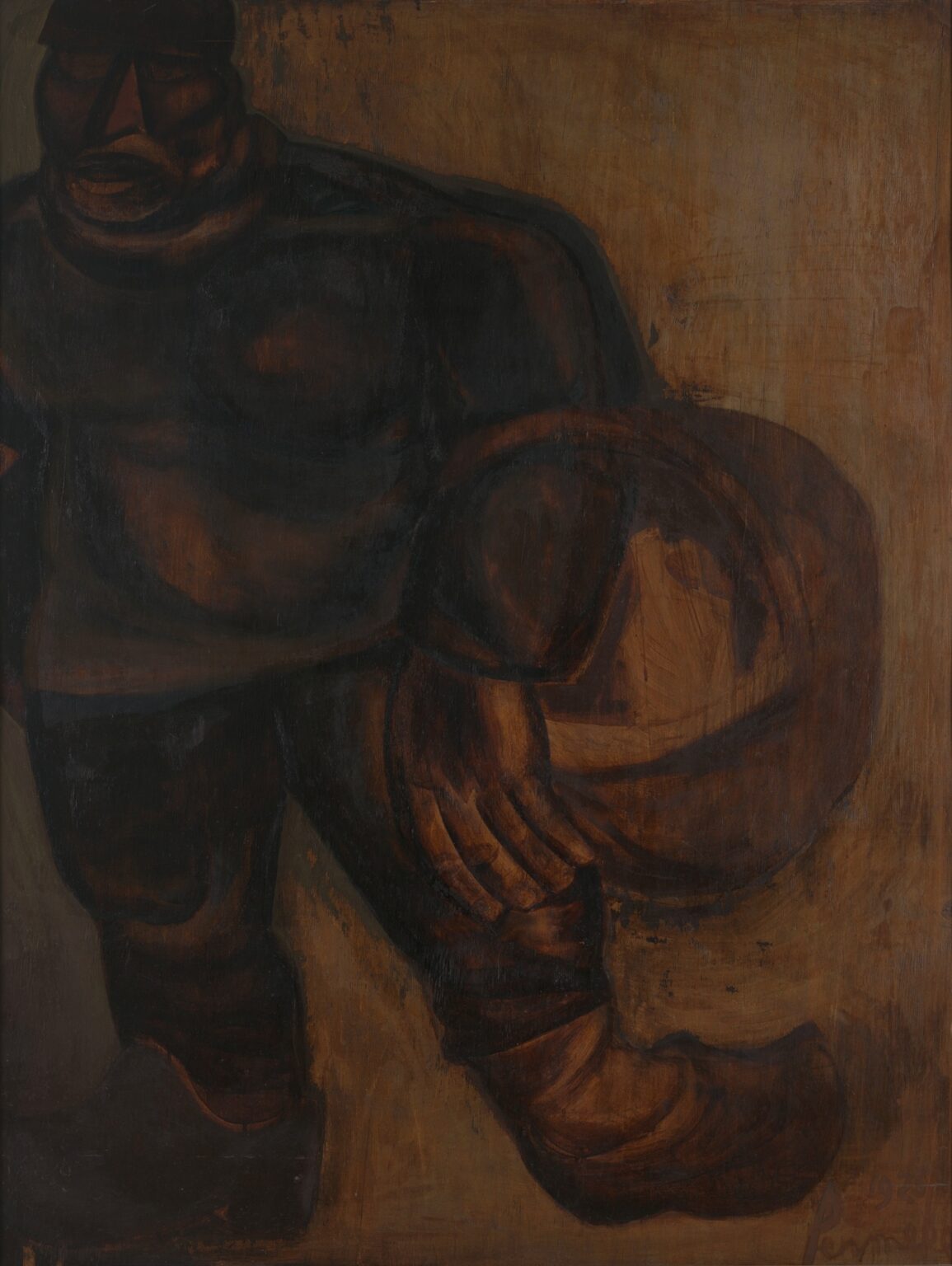 Constant Permeke’s 1925 Expressionist painting “The Man Dragons” shows a towering, half-cropped figure in dark work clothes stepping forward while carrying a heavy, circular object against a warm ochre background, rendered in thick, earthy brushstrokes.