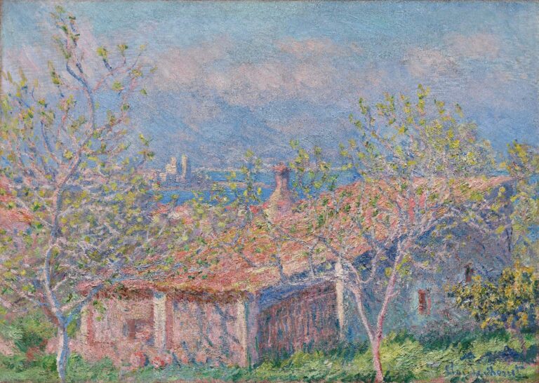 A sunlit stucco house with a terracotta tile roof nestled among young trees with fresh green leaves, set on a hillside overlooking a deep blue Mediterranean sea under a bright, cloud-dappled sky.