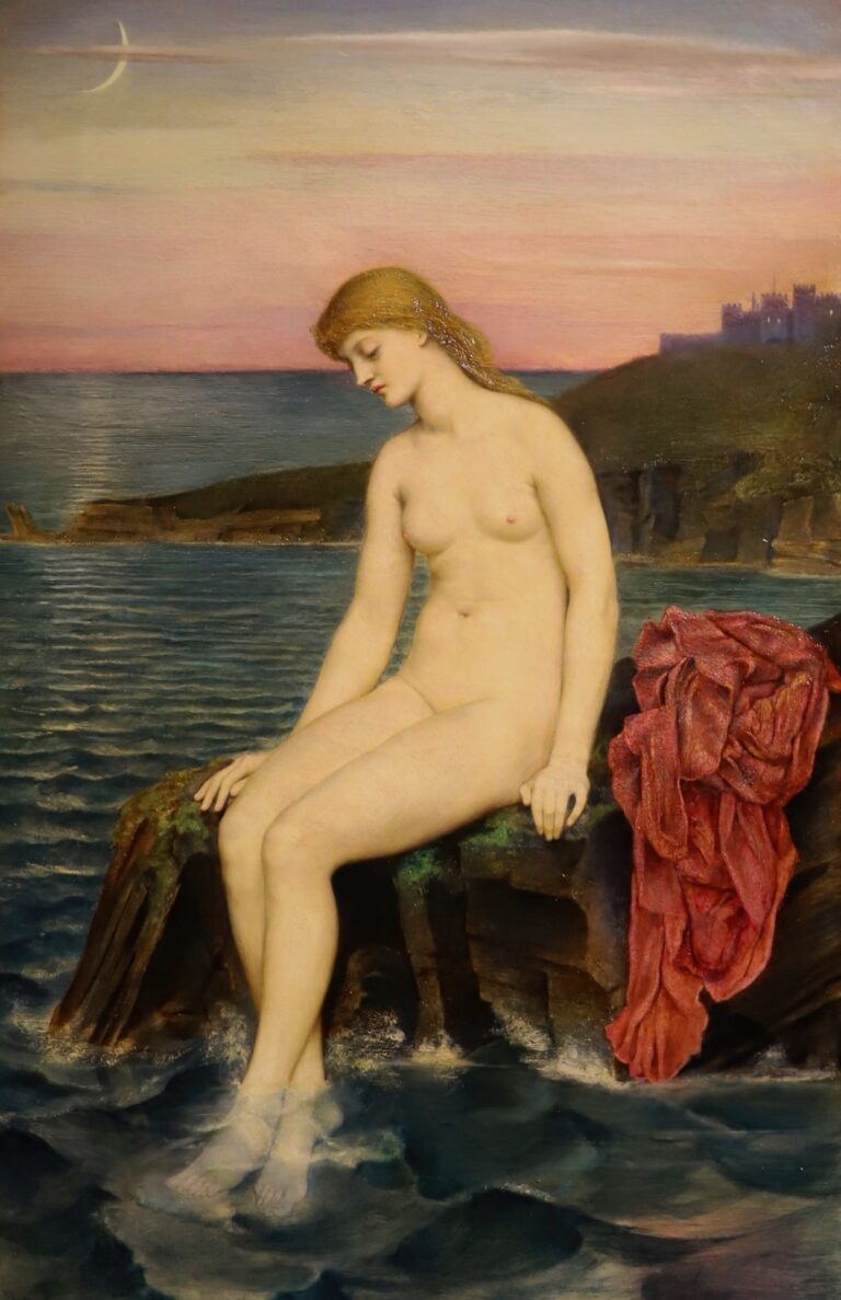 A nude young mermaid with long golden hair sits on a rocky outcrop at twilight, her pale feet immersed in gentle waves, a red shawl draped beside her, beneath a slender crescent moon and a distant castle silhouette in Evelyn De Morgan’s painting The Little Mermaid.