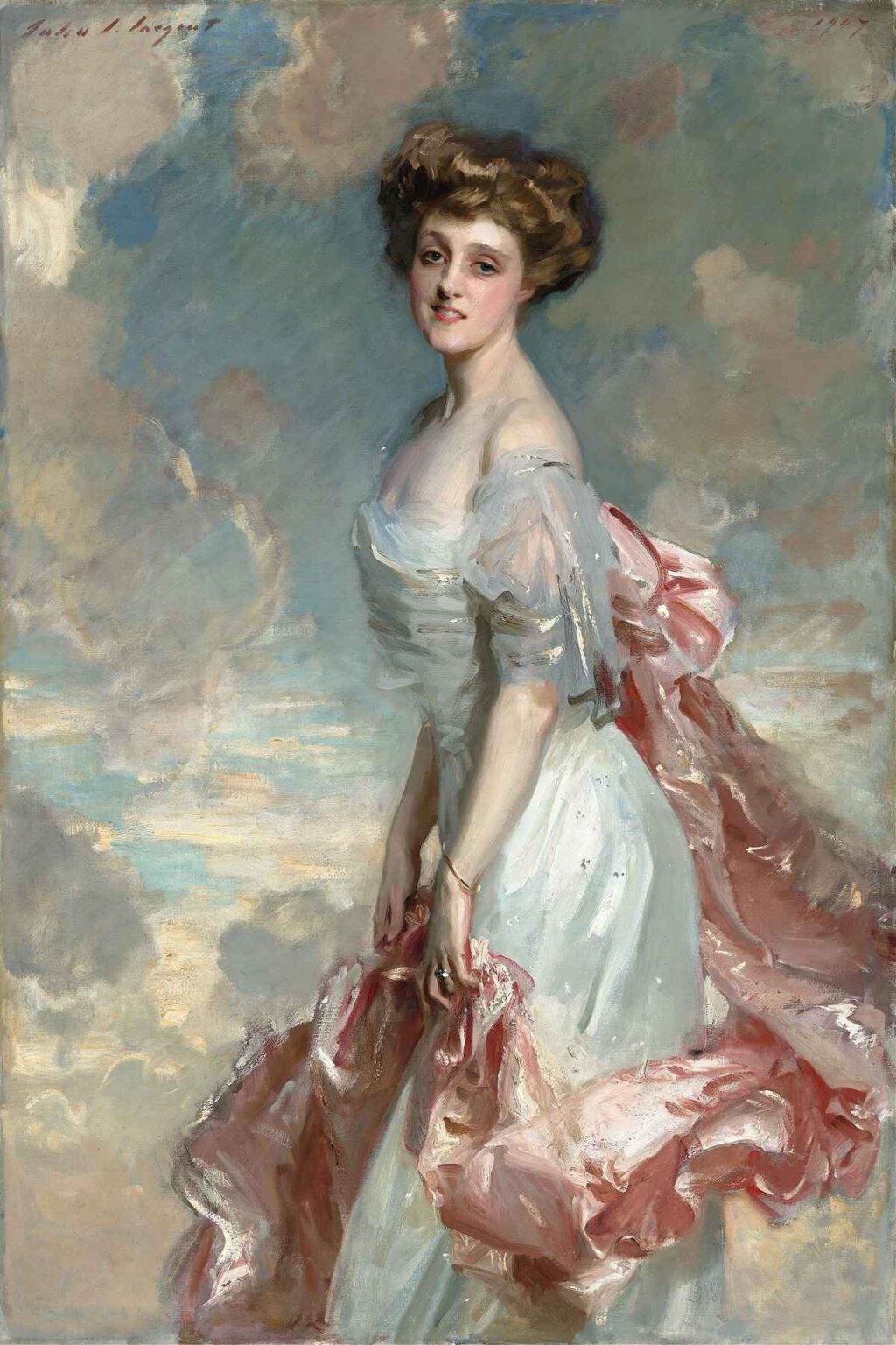 Full‐length portrait of a young woman in a white silk gown with billowing pink satin drapery, standing against a softly clouded, sky‐colored background.