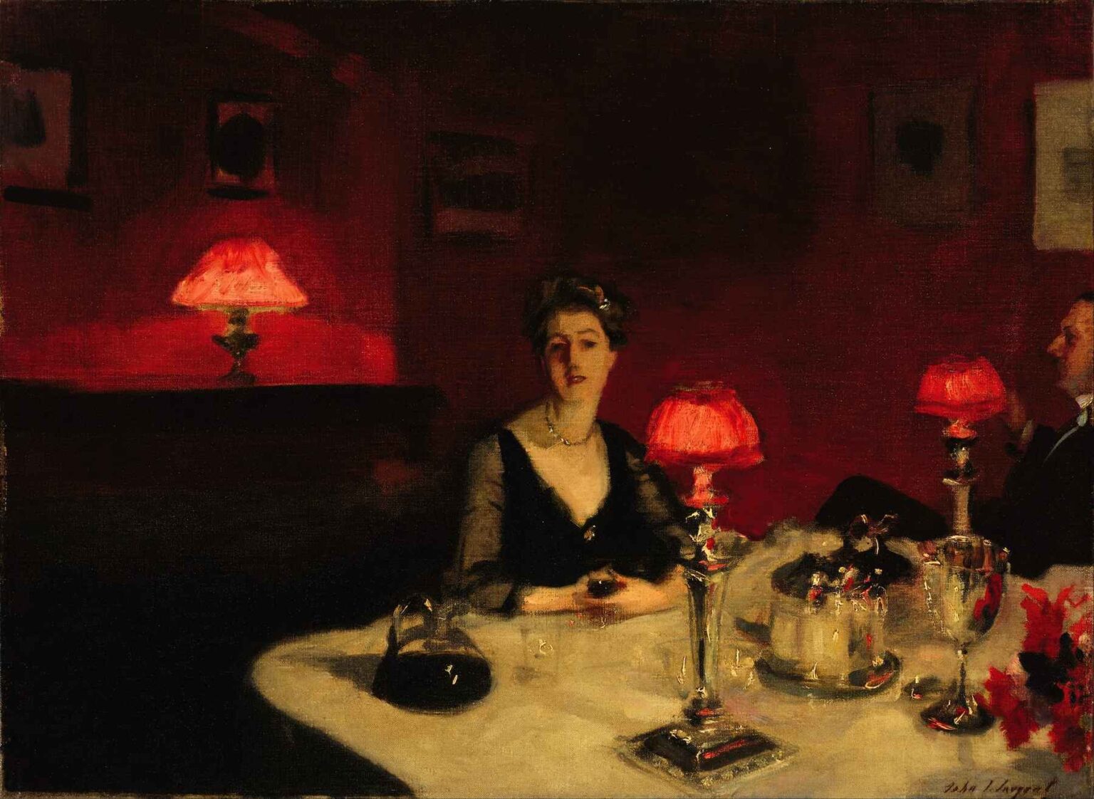 A Complete Analysis of “A Dinner Table at Night” by John Singer Sargent – A dimly lit dining room scene with a white-clothed table set with silver dishes and glassware, illuminated by small red-shaded lamps, and two figures seated against a deep red background.