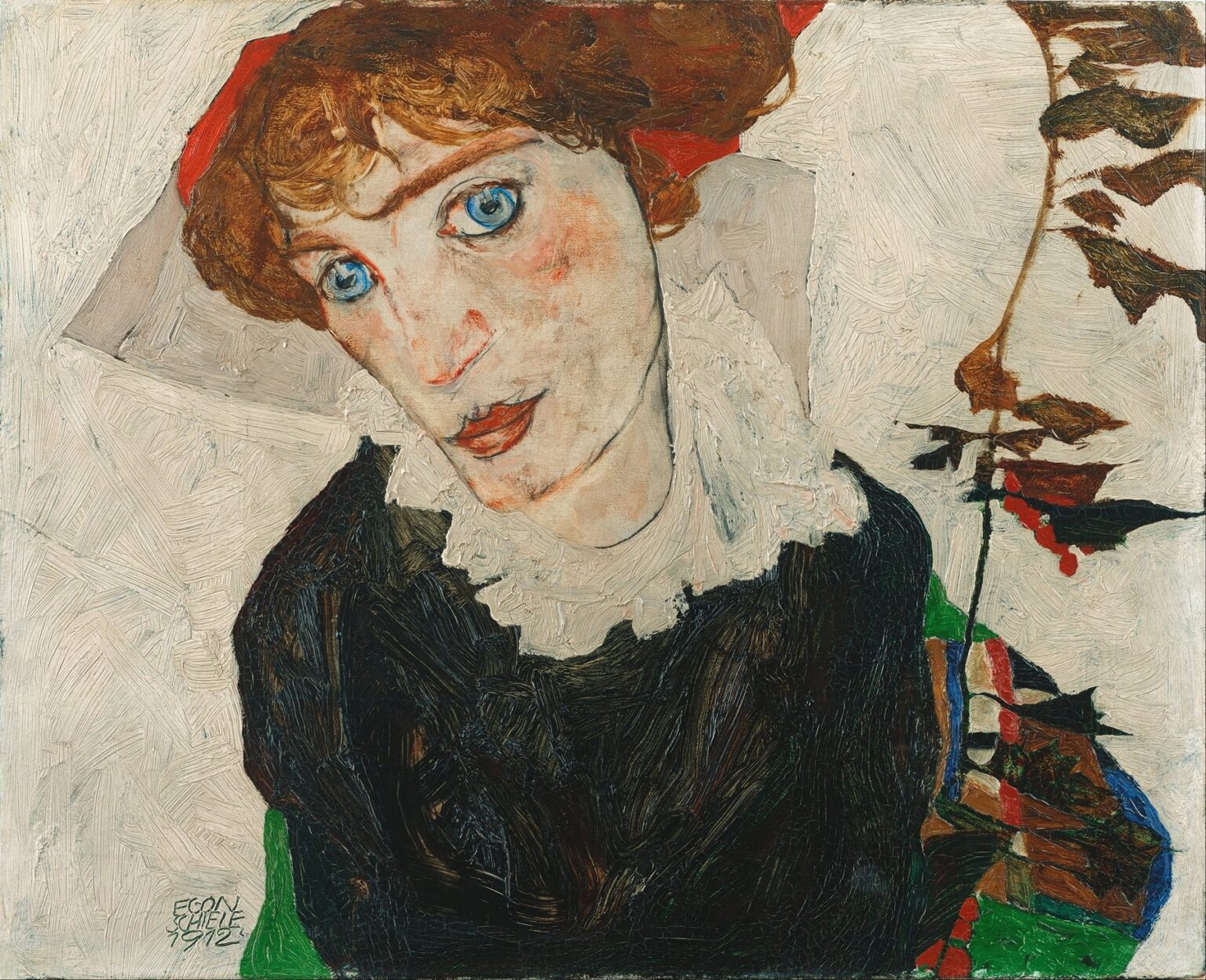 A close-cropped portrait of a young woman with pale skin, large blue eyes, and auburn hair under a red cap, her head tilted and shoulders draped in black, set against a flat beige background.
