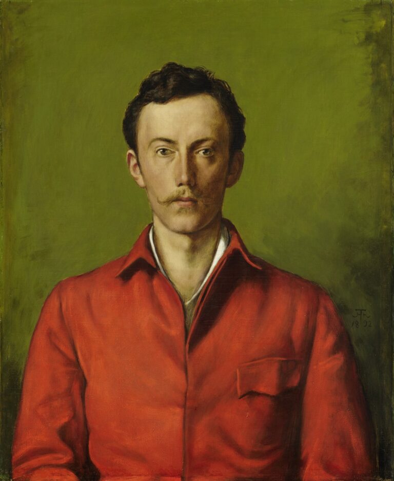 Head-and-torso portrait of a young man with a mustache wearing a bright red jacket over a white shirt, set against a smooth olive-green background, gazing directly at the viewer with a calm expression.