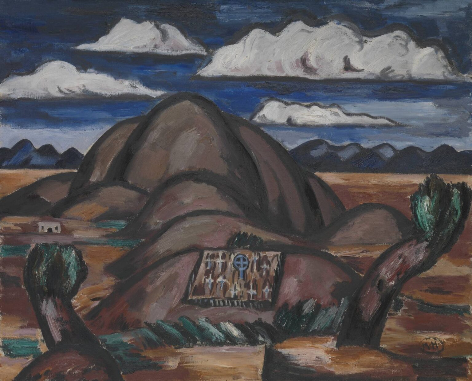 Marsden Hartley’s Cemetery, New Mexico (1924), oil on canvas displaying an adobe burial mound draped in an embroidered cloth, flanked by two gnarled desert trees, with rolling hills and a deep blue sky of horizontal clouds.
