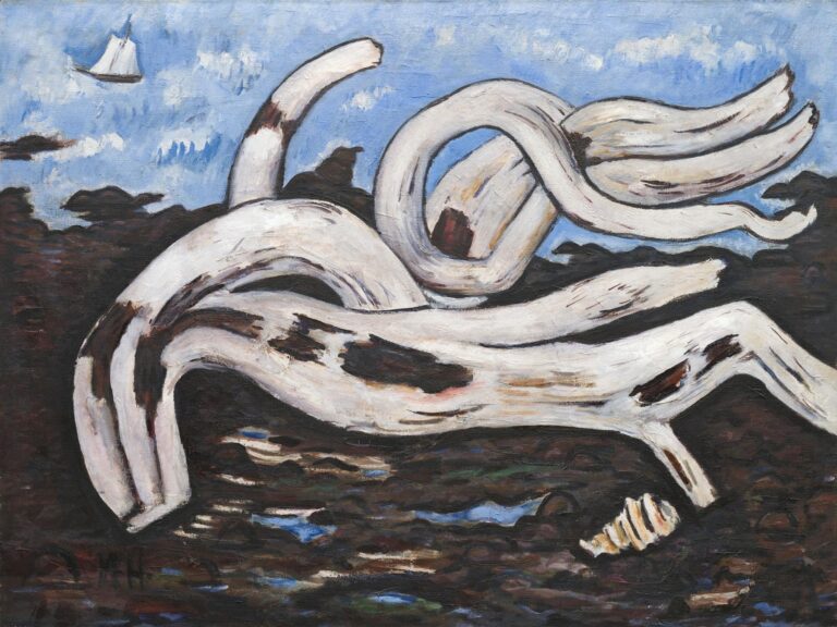 Oil painting by Marsden Hartley, “Driftwood on the Bagaduce” (1940): a massive, twisting white driftwood log sprawls across a dark rocky shore under a bright blue, cloud-dotted sky, with a tiny white sailboat on the horizon and a small shell near the foreground, all defined by thick black contours and expressive brushstrokes.