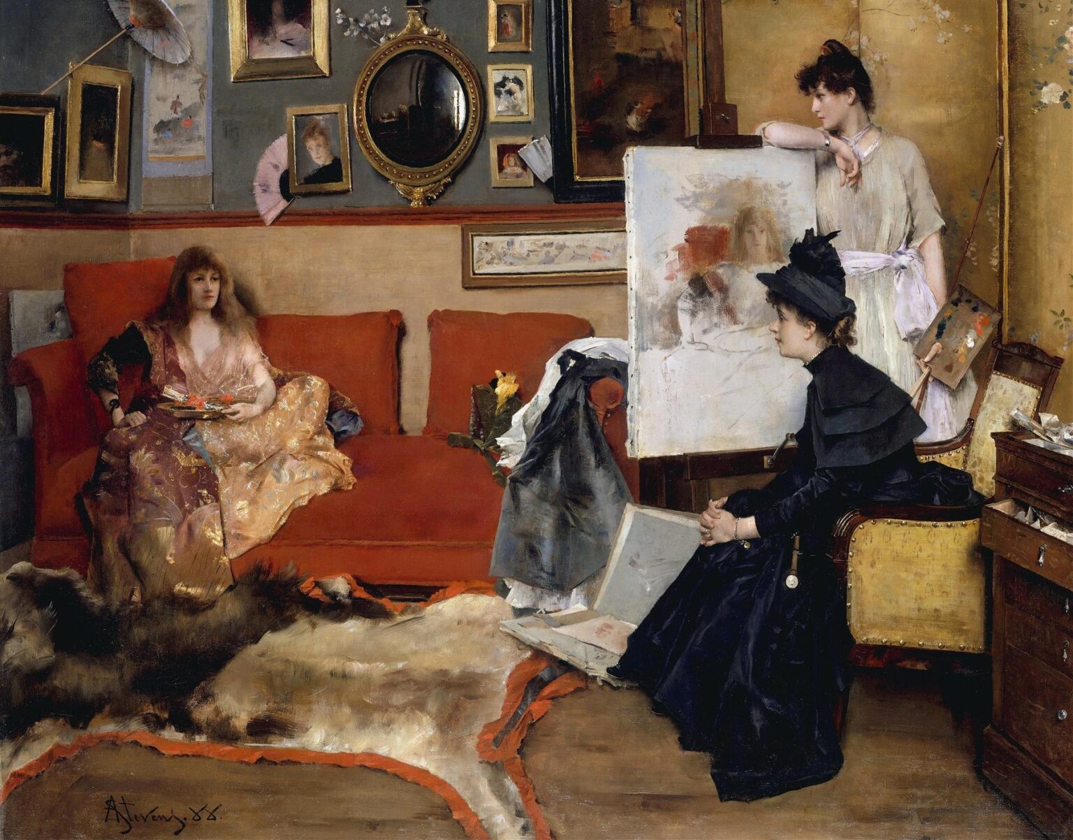 A female painter in a black dress sits before an easel, palette in hand, while her model reclines on a red sofa beneath framed art and fans in a richly decorated 19th‑century studio.