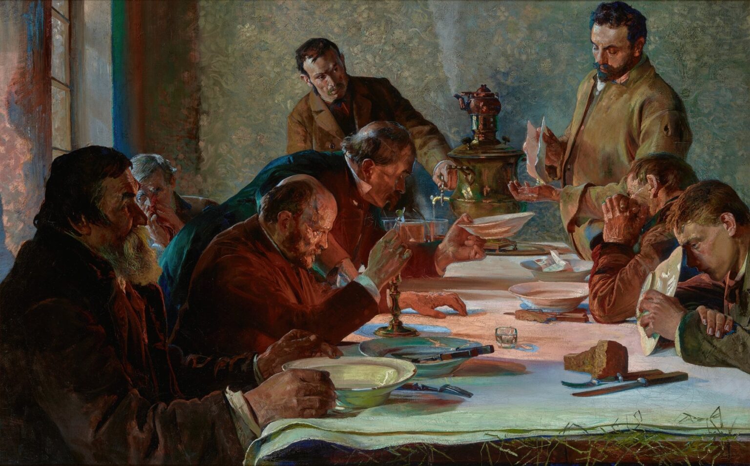 Oil painting by Jacek Malczewski showing a group of Siberian exiles around a white-clothed table on Christmas Eve, sharing bowls of soup and bread beside a steaming samovar in a dim, confined room.