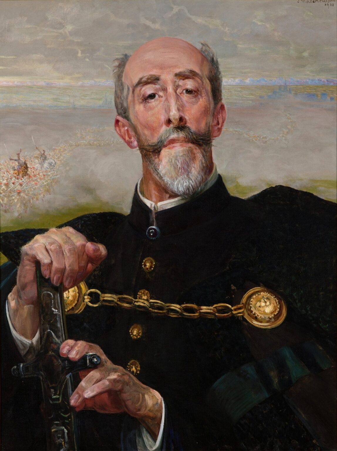Oil painting by Jacek Malczewski showing Count Antoni Wodzicki seated in a dark ceremonial cloak with gold medallions, hand on the hilt of a sword, set against golden fields and distant violet mountains under a cloud-filled sky.