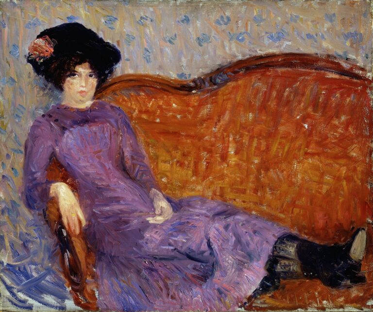Oil painting by William Glackens showing a young woman reclining on an orange-red sofa, wearing a flowing purple dress and black hat with a pink flower, set against a gray-blue patterned wall.