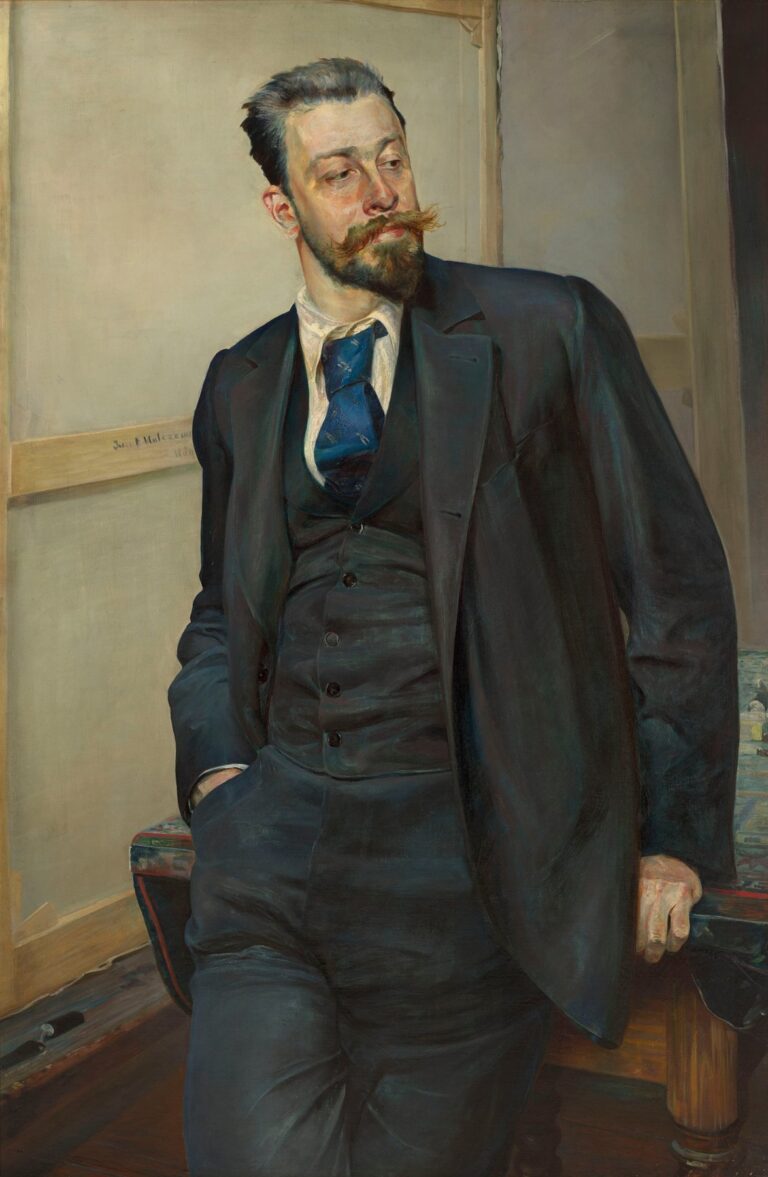 Oil painting by Jacek Malczewski showing a casually posed Michał Wywiórski in a dark suit with rolled sleeves, leaning against a studio table with a canvas stretcher behind him, his gaze directed off to the side.