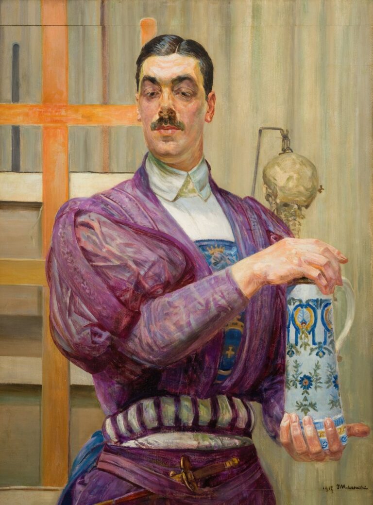 Oil painting by Jacek Malczewski showing a young man in purple robes holding a decorated faience jug, framed by an easel’s wooden beams and a suspended skull against a subtly striped studio backdrop.