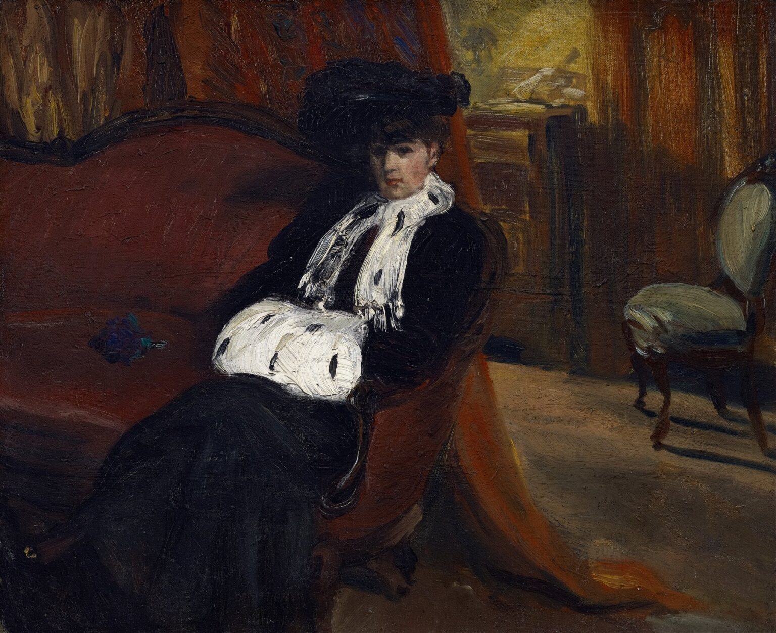 Oil painting of a woman seated on a red sofa wearing a dark dress and white ermine muff in her lap, set against warm drapery and rendered with loose, expressive brushwork by William James Glackens, 1903.