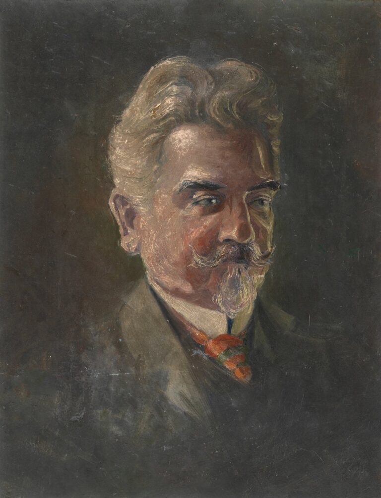 Head-and-shoulders portrait of a middle-aged man with wavy light hair, mustache and goatee, wearing a dark suit and striped tie, his face turned in three-quarter view against a dark, textured background.