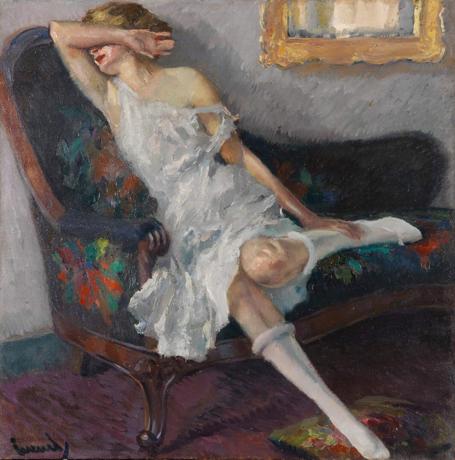 Oil painting of a woman in a white lace dress reclining on a floral chaise longue, her arm shielding her eyes, set against a gray wall with a gilded frame above.