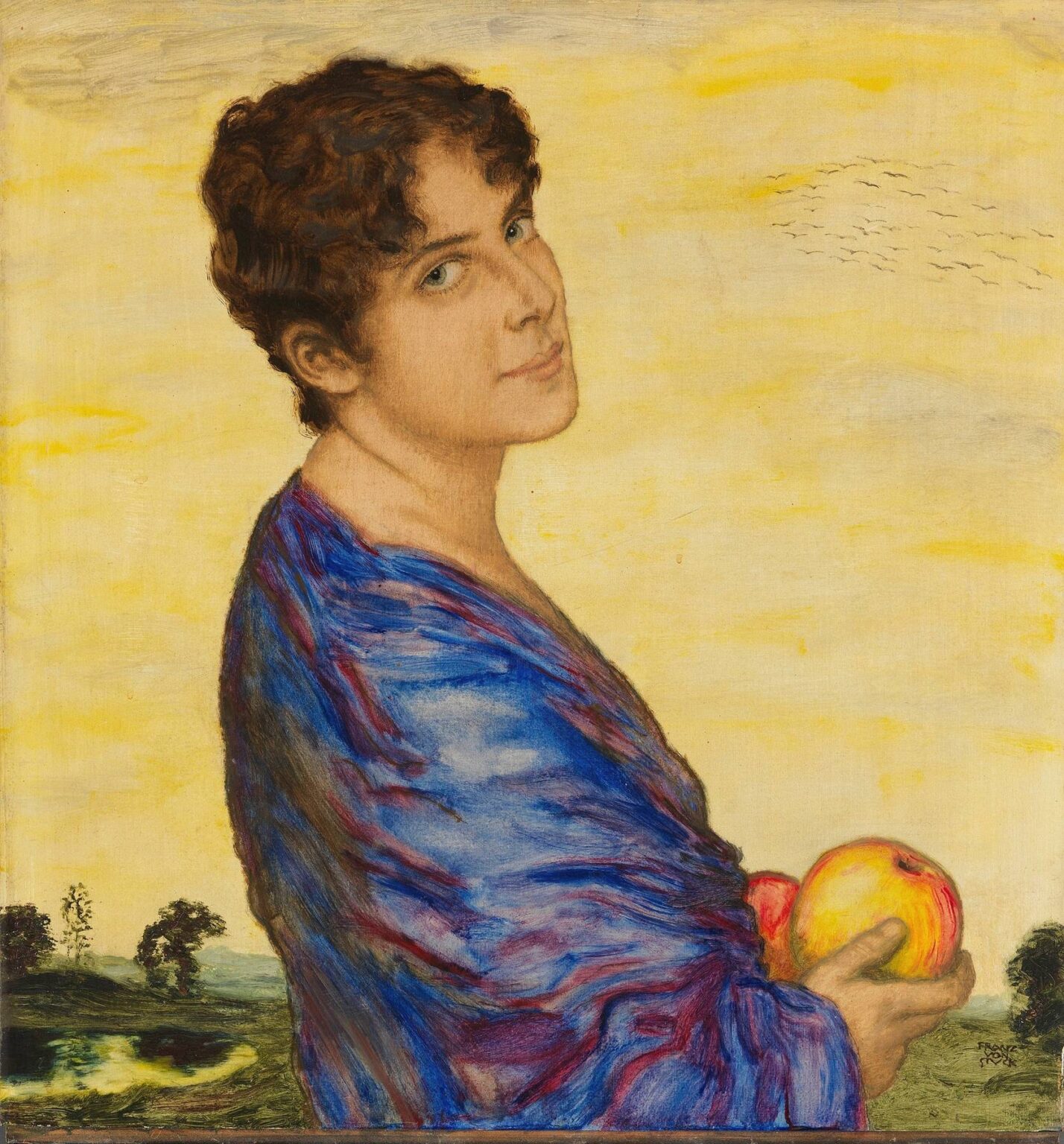 A serene woman with short dark curls and a gentle smile, wearing a flowing blue robe and holding apples, stands before a golden sky and quiet landscape in Franz von Stuck’s Portrait of Mrs. von Stuck (1914).