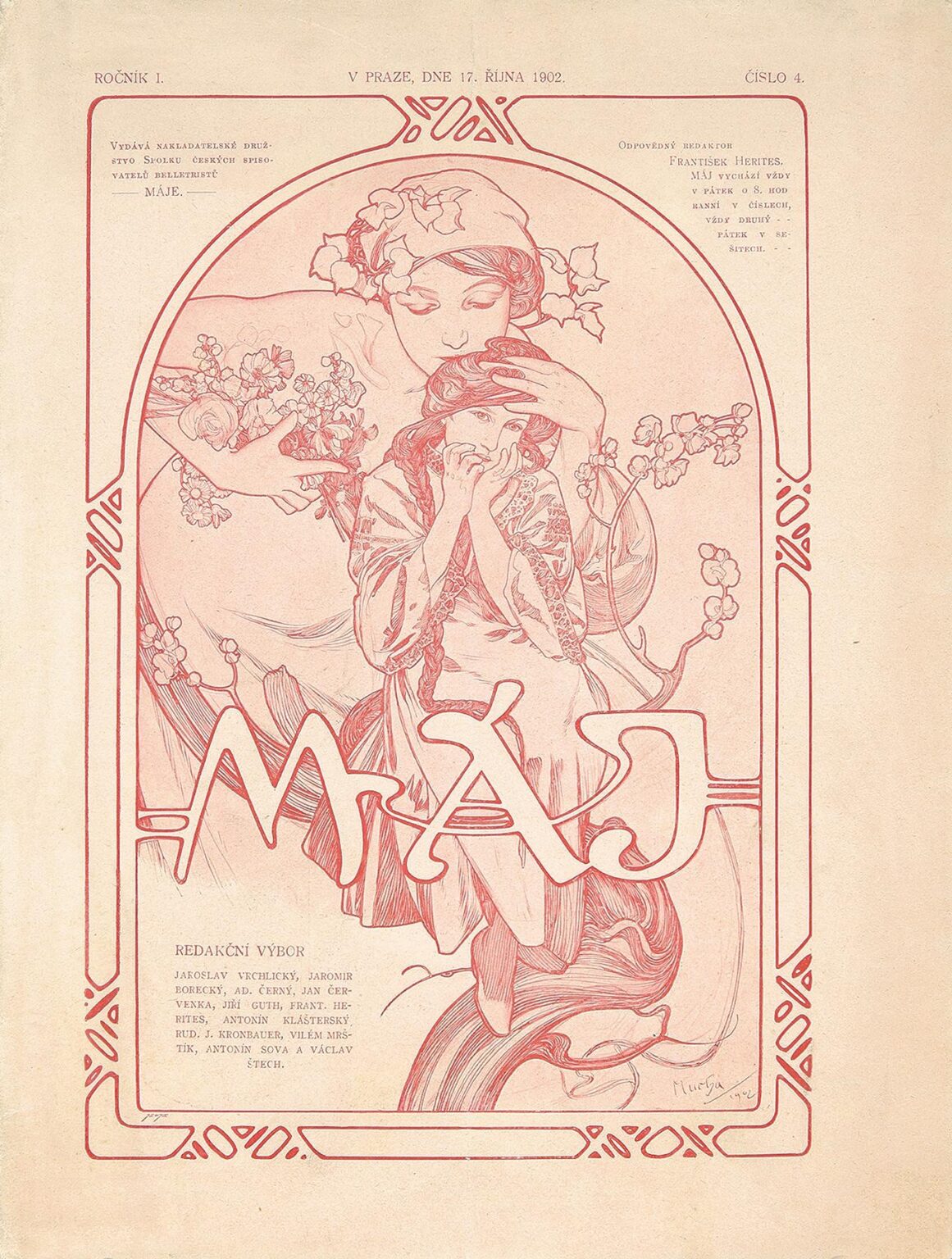 An Art Nouveau magazine cover in rose-red and cream showing a protective mother figure standing behind a young girl, both surrounded by a circular frame of blooming spring branches; the hand-lettered title “MÁJE” overlaps the circle, with decorative border motifs in the corners.