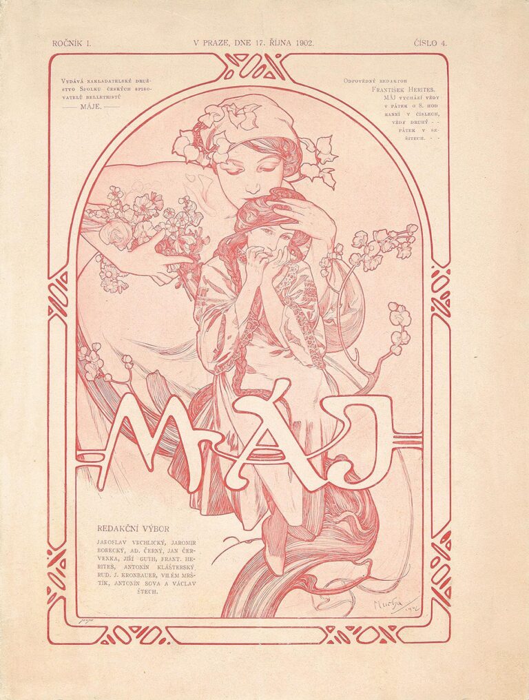 An Art Nouveau magazine cover in rose-red and cream showing a protective mother figure standing behind a young girl, both surrounded by a circular frame of blooming spring branches; the hand-lettered title “MÁJE” overlaps the circle, with decorative border motifs in the corners.