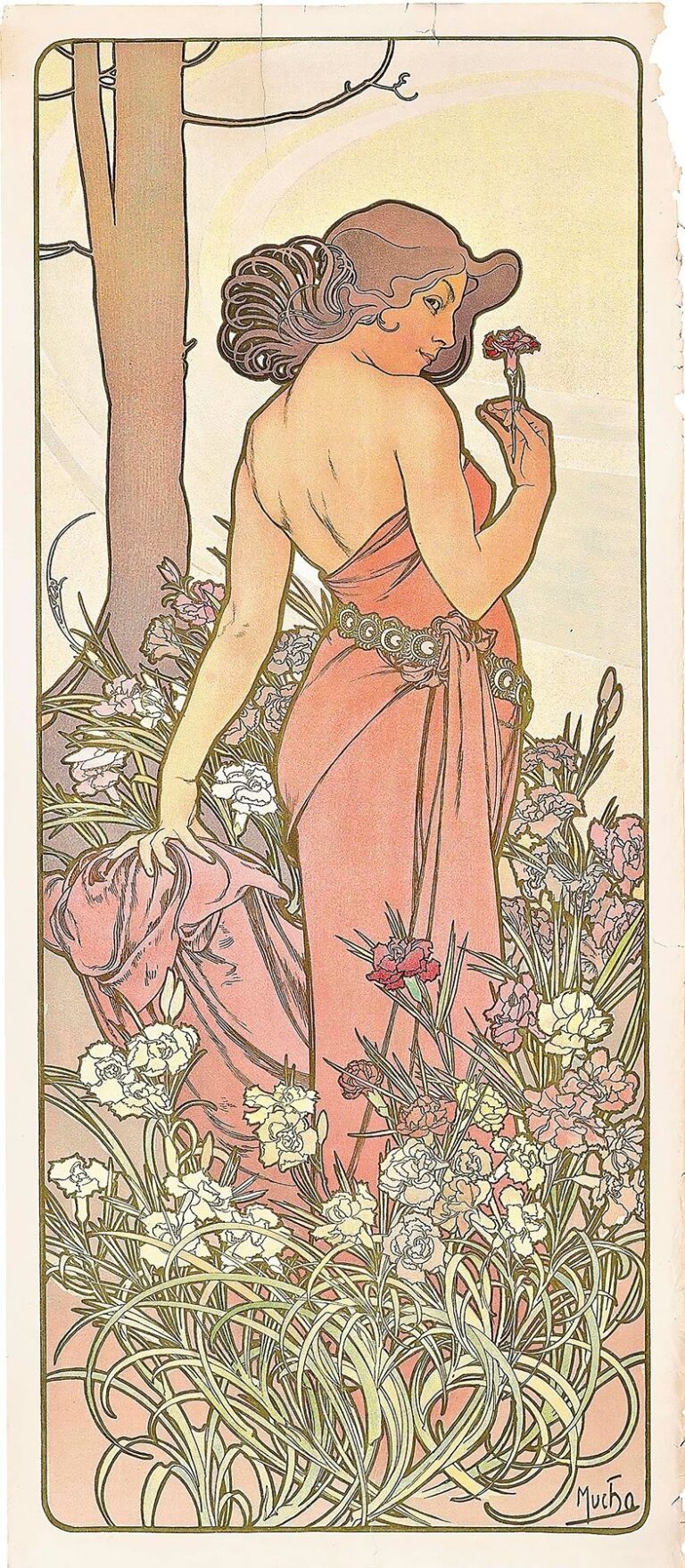 Alphonse Mucha’s 1897 lithograph “The Carnation” depicting a graceful woman in a flowing rose-pink gown surrounded by blooming carnations and stylized foliage against a pale golden halo.
