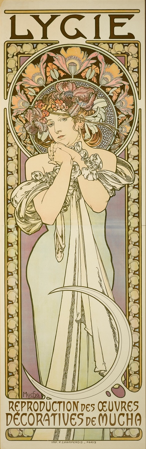 A tall, vertical Art Nouveau poster by Alphonse Mucha depicting a graceful young woman in a flowing pale green gown with floral garland and stylized lily halo, standing within an ornate circular frame of blossoms and geometric pattern, titled “LYGIE” above and “Reproduction des œuvres décoratives de Mucha” below.