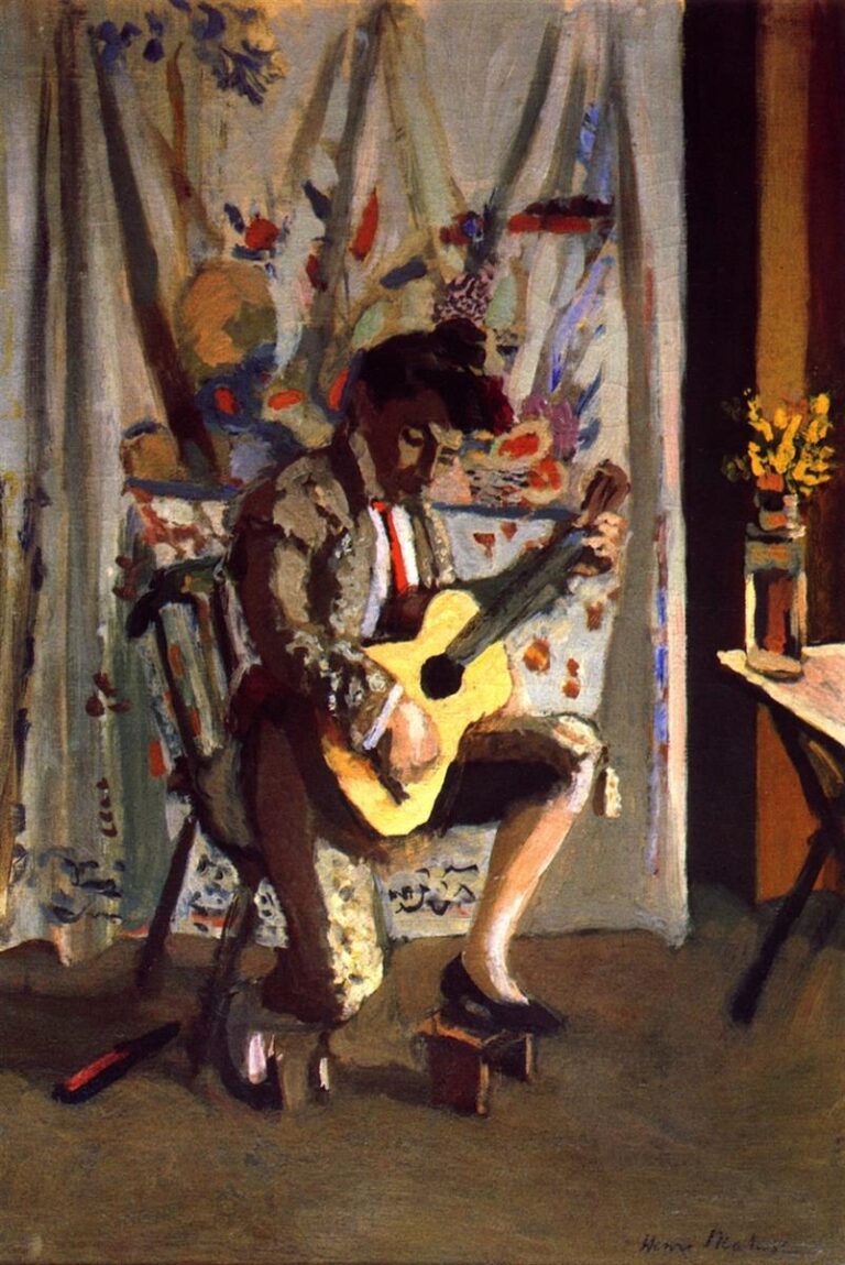 Seated musician in a patterned room playing a yellow guitar; figure in dark, faceted clothing sits on a chair with one foot on a small block; pale curtain filled with loose floral motifs behind; at right a vase of yellow flowers on a table beside a dark doorway; calm, evenly lit interior painted with broad, simplified planes.