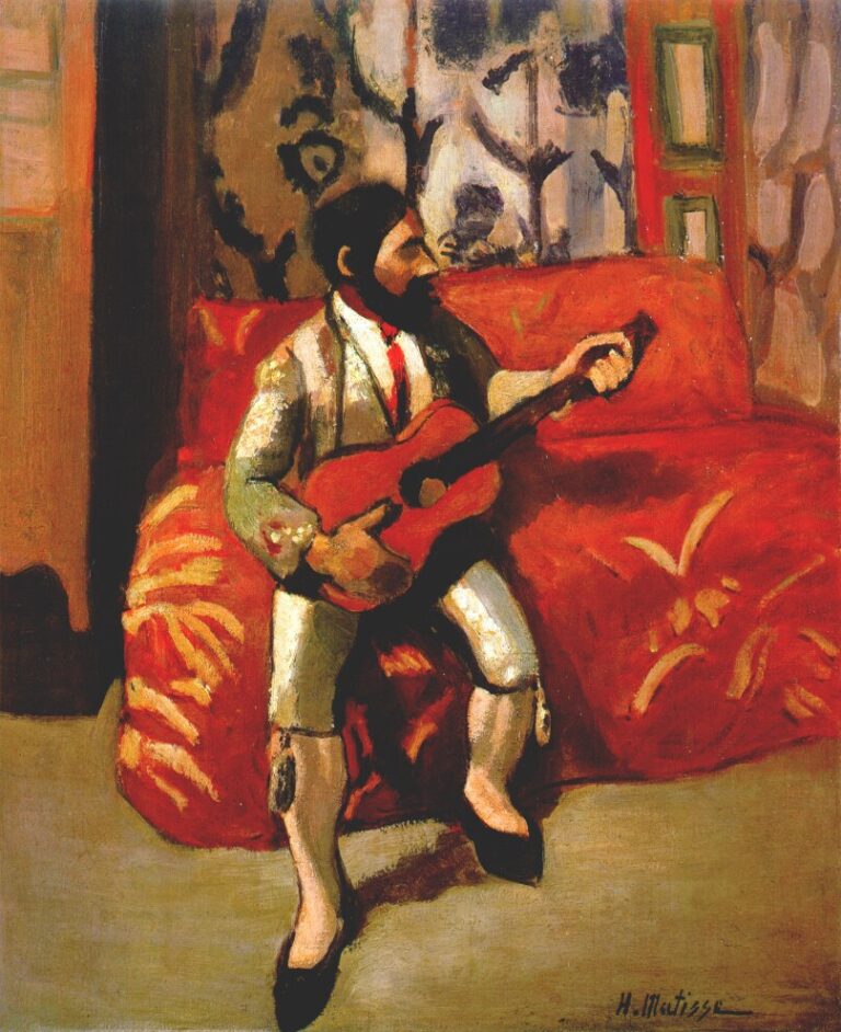 Interior scene of a bearded man in a pale suit playing a red guitar while seated on a bright red patterned sofa; patterned wall behind, green-edged panel at right, gray floor below; strong dark contours and simplified planes create a warm, shallow, decorative space.