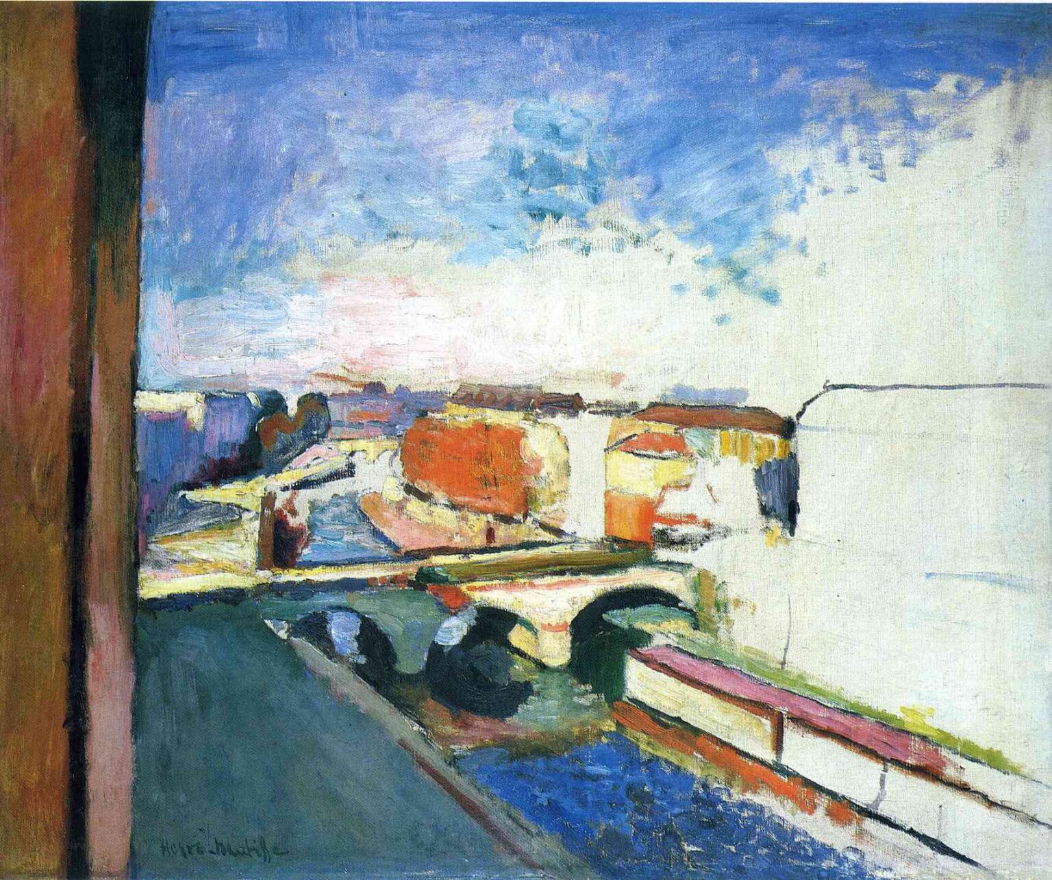 High window view of Pont Saint-Michel over the Seine: pale stone bridge with two dark arches, blue river, orange-cream buildings at left, wide bright reserve at right, and a breezy blue sky framed by a brown window jamb.