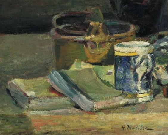 Small still life by Henri Matisse showing a stack of green books, a blue-and-white mug, and a brass pot on a tabletop, painted in warm earth tones with soft light from the left (1895).