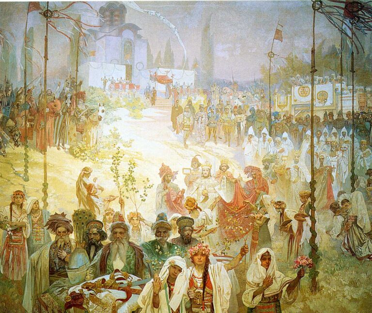 Vast festival scene by Alphonse Mucha showing Stefan Dušan and his consort advancing under a red canopy along a sunlit road from an Orthodox church; crowds in regional dress carry banners, flowers, and branches, elders present gifts at a foreground table, and tall poles with ribbons frame the scene amid warm golds, greens, and soft violets.