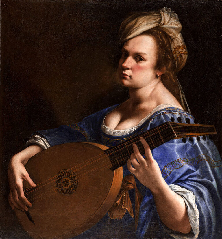 A young woman in a blue gown and pale turban turns toward the viewer while holding a lute across her chest; strong light models her face, hands, and instrument against a dark background, conveying poised concentration just before music begins.
