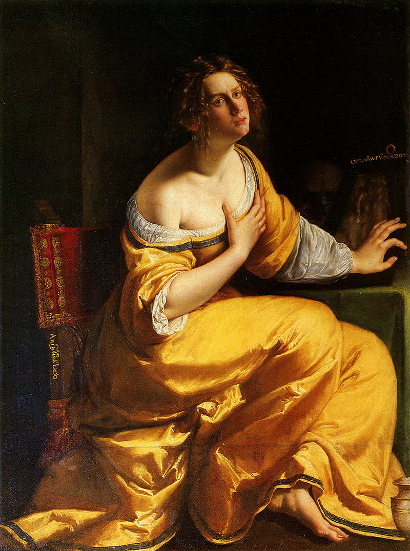 Kneeling Mary Magdalene in a glowing yellow robe turns toward light with a hand over her chest while withdrawing from a shadowed table holding a mirror and ointment jar, her expression intent and reflective against a dark background.