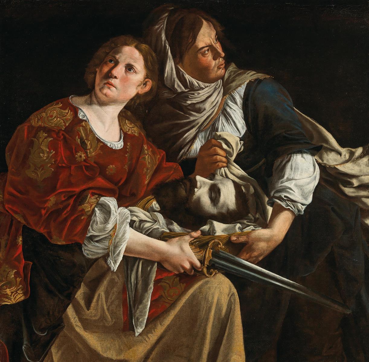 Judith in red brocade and her maid in darker dress lean together in a dark interior, cradling Holofernes’s severed head in a cloth while Judith’s sword extends diagonally, both women turning their alert gazes toward opposite sides as they prepare to escape.
