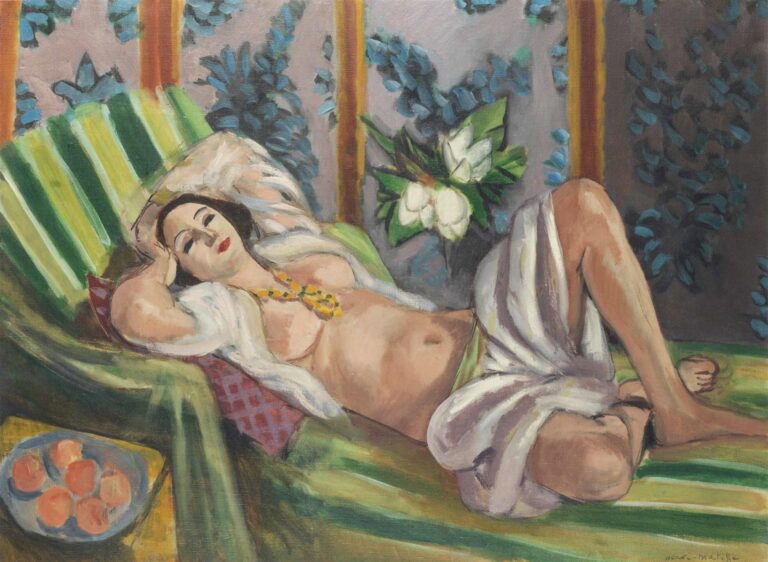 Reclining woman on a green-striped divan, head left and knees raised right, wearing a yellow necklace and white drapery; behind her a gray screen with blue leafy patterns and a cluster of white magnolias; small table with peaches at lower left; soft Mediterranean light and clear, modern color.
