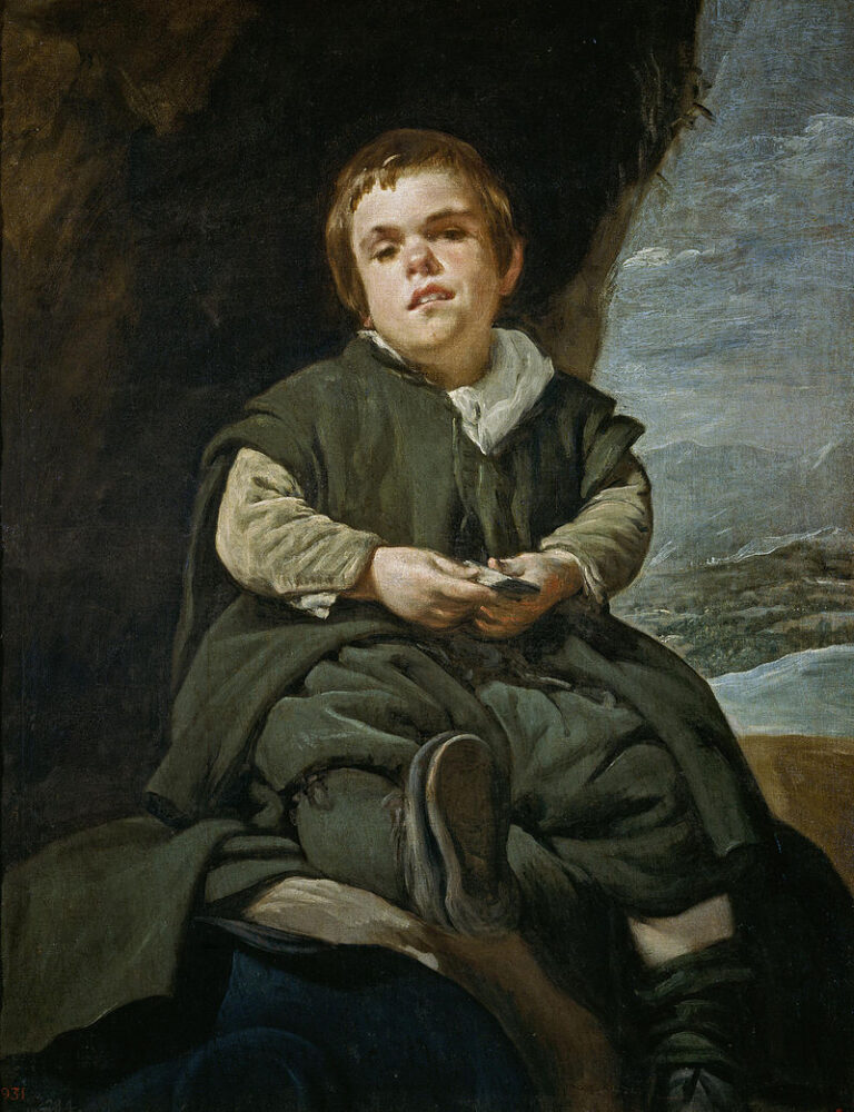 Seated portrait of the court dwarf Don Francisco Lezcano in green cloak at a grotto entrance, holding cards with hands in his lap, one foot extended toward the viewer, with a bright landscape and cloudy sky visible at right.