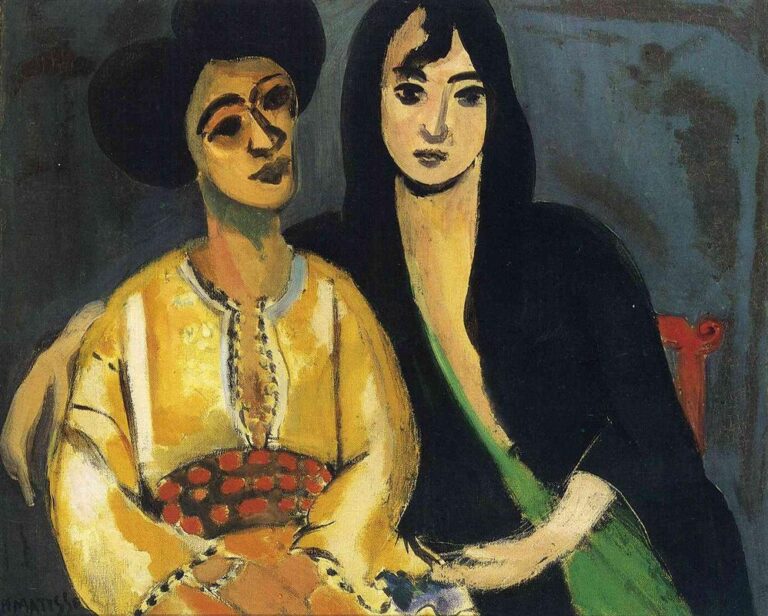 Two women seated closely together in a 1917 Henri Matisse painting: the left figure wears a bright yellow embroidered tunic and rounded dark hair; the right figure, Laurette, is wrapped in a black mantle with a diagonal green sash. A red-spotted oval cushion rests between them against a smoky blue-gray background, with strong black contours and simplified, expressive faces.