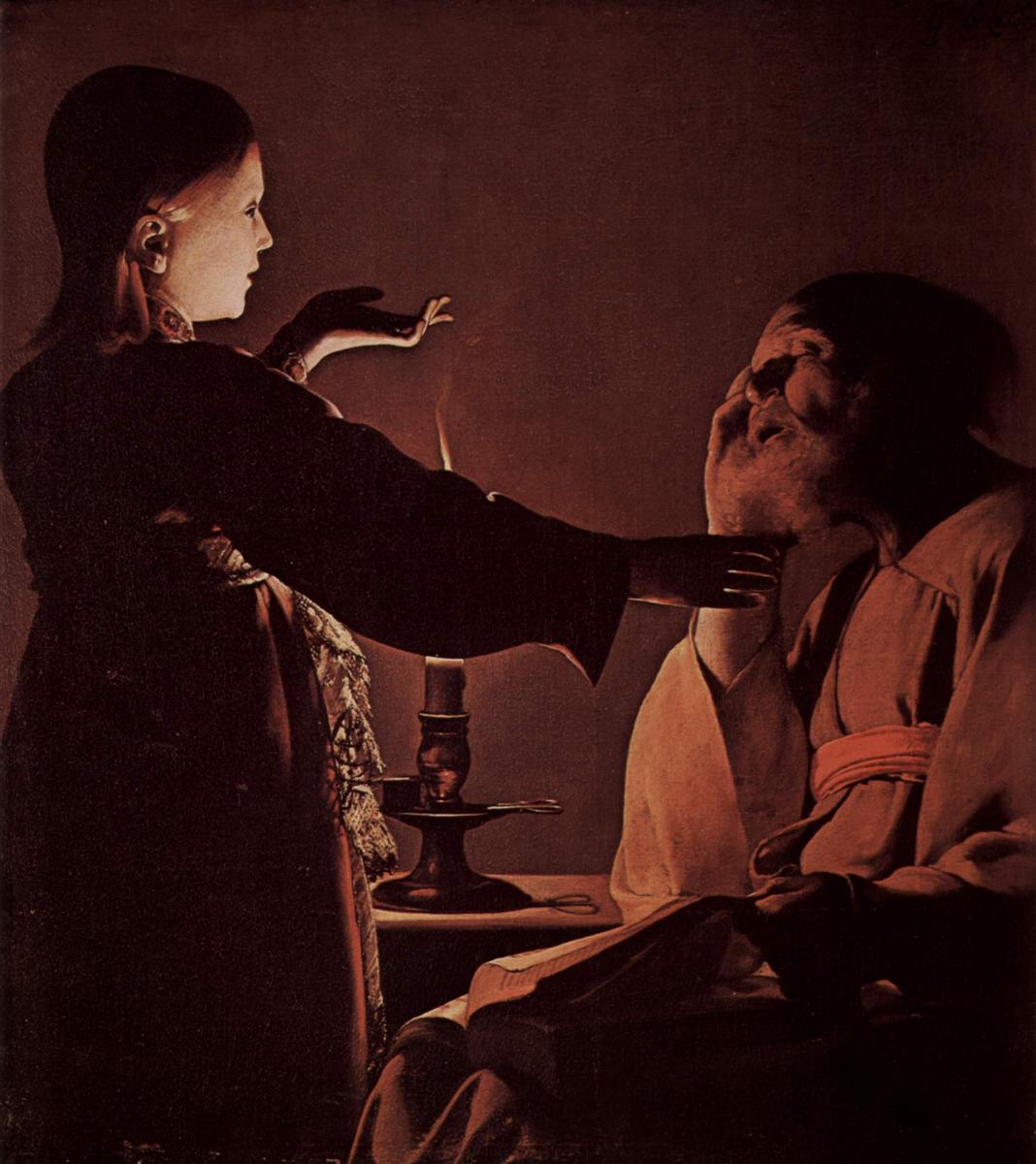 Candlelit scene of a young angel standing in profile with hands raised toward the seated St. Joseph; a small flame glows between them on a brass holder, an open book lies on Joseph’s lap, and warm shadows model both figures against a simple wall.