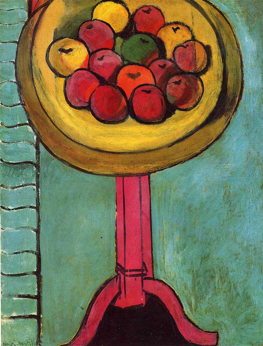 Golden bowl of red, orange, yellow, and one green apple atop a tall hot-pink pedestal table against a matte green background; black contours define dish, fruit, and pedestal; narrow wavy vertical band at left; simplified forms and bold color typical of Matisse in 1916.