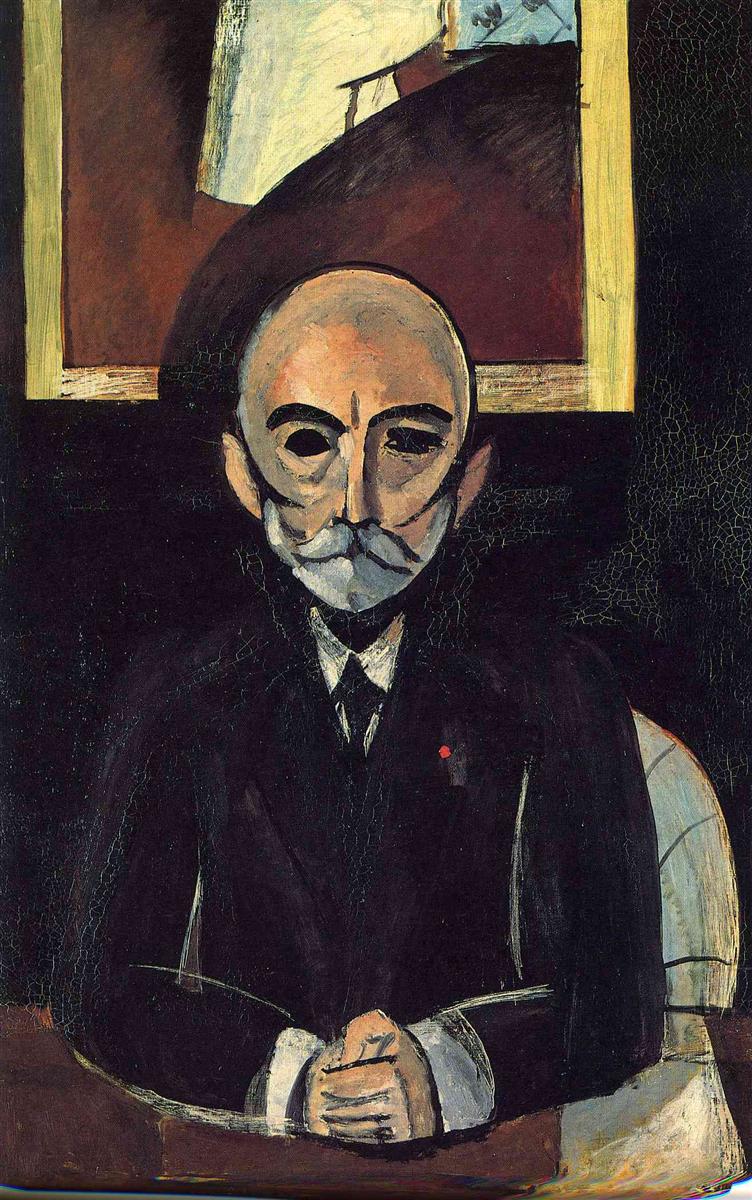 A stark frontal portrait by Henri Matisse of a bald, mustached man in a black suit seated at a desk, hands clasped, a tiny red badge on his lapel; behind him a dark wall and a framed picture with rusty red and pale blue areas; strong black contours, simplified facial planes, and minimal color create a severe, modern image.