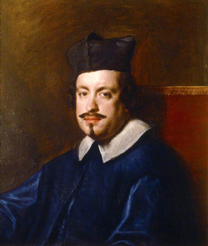 Half-length portrait of Cardinal Camillo Massimi wearing a black biretta, blue clerical garment, and white collar, seated before a warm brown background with a red chair back, his face turned gently toward the light with a calm, intelligent gaze.