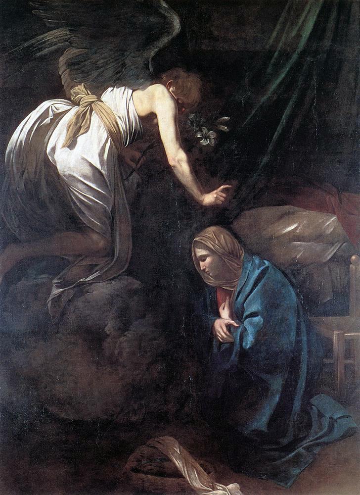 A dim interior where an angel in white descends on a small cloud, extending a hand and holding lilies, while Mary kneels in deep blue with head bowed; sparse furniture and heavy shadows create a quiet, intimate Annunciation scene.