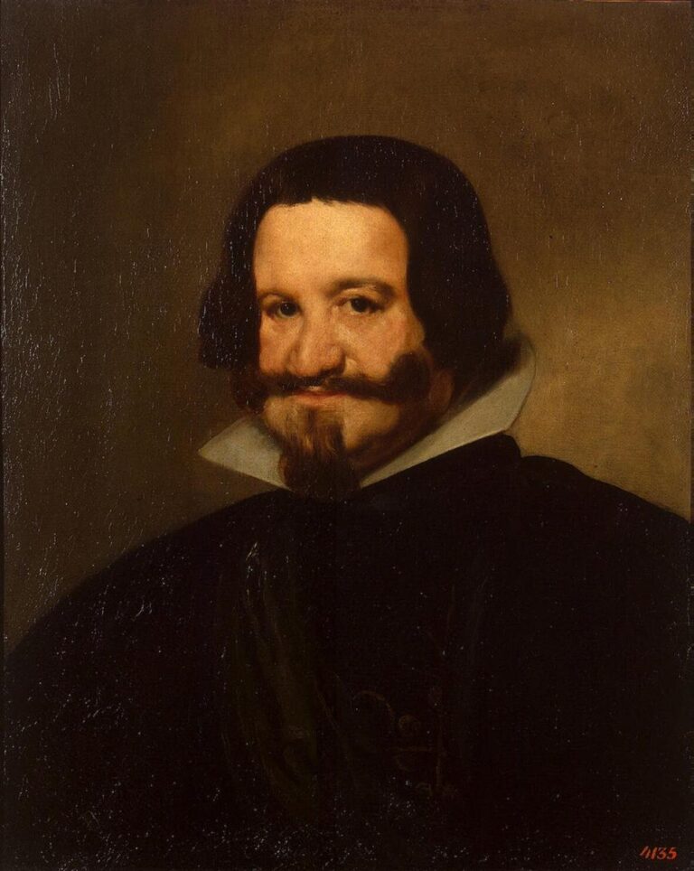 Close head-and-shoulders portrait of the Count-Duke of Olivares facing the viewer, with a white ruff, dark coat, and curled moustache and pointed beard, set against a warm neutral background with soft light modeling the face.