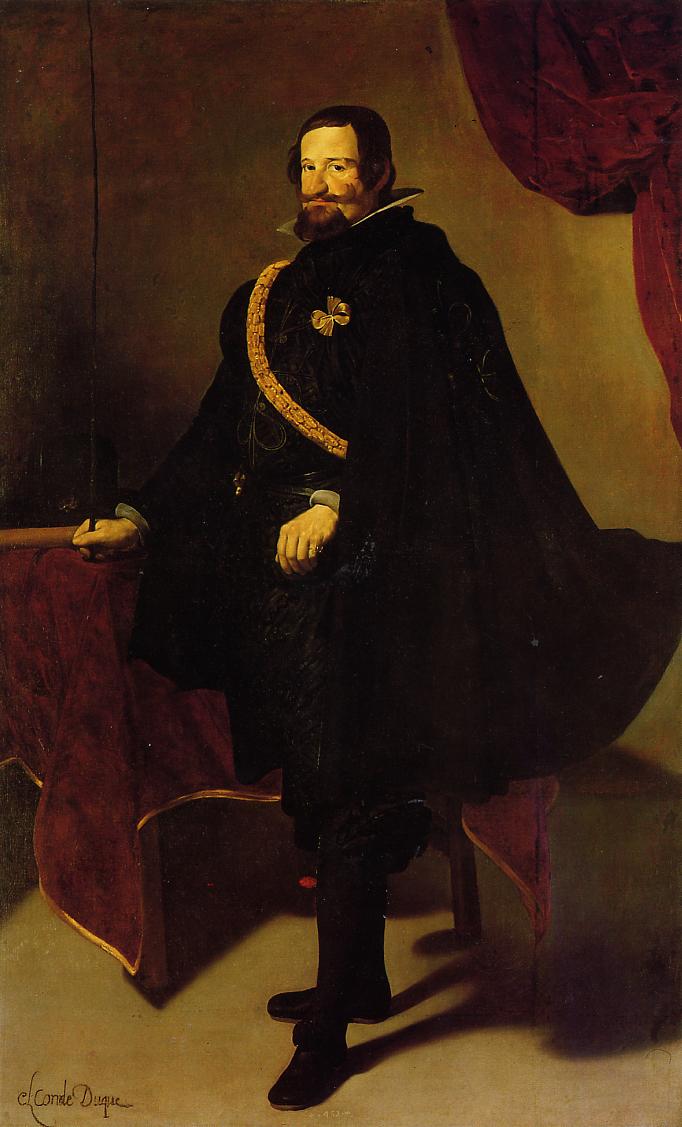 Full-length portrait of the Count-Duke of Olivares standing beside a red-draped table, wearing a voluminous black cloak with a gold diagonal sash and a high white collar, set in a shallow room with a red curtain; painted by Diego Velazquez in 1627.