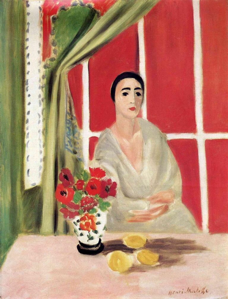 A woman in a pale robe sits at a pink table with a white vase of red flowers and three yellow lemons; a green curtain is drawn back to reveal a red wall divided by white bars, creating a serene, brightly lit interior.