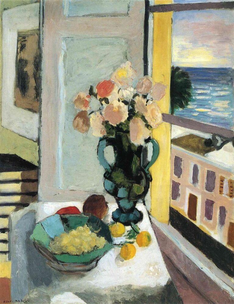Interior with a white table holding a green-glass vase of pink and cream flowers beside a green bowl of fruit and three lemons; to the right an open window reveals blue sea and sky and a building façade; pale gray paneling and warm yellow jambs frame the view in Matisse’s calm Nice-period palette.